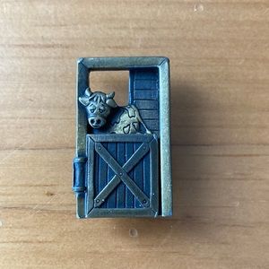 Cute little cow and farmer pin with moving barn door, vintage JJ